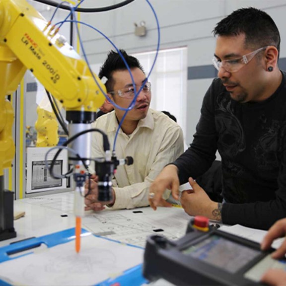 Instructor teaching about robotic arm