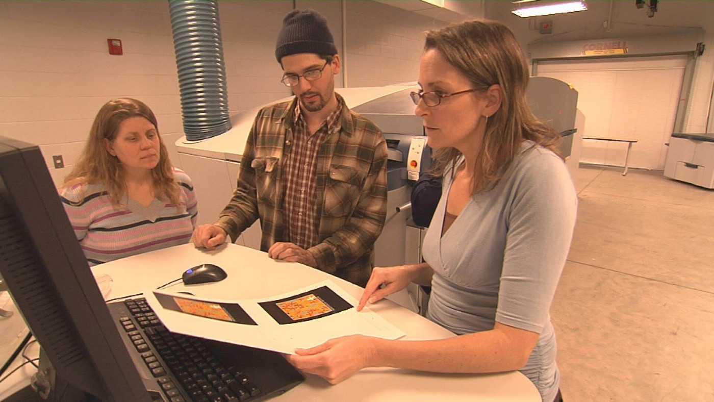 Students reviewing a print proof